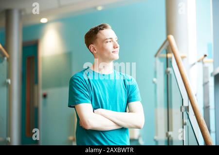 Ambitious young male college student looking away Stock Photo