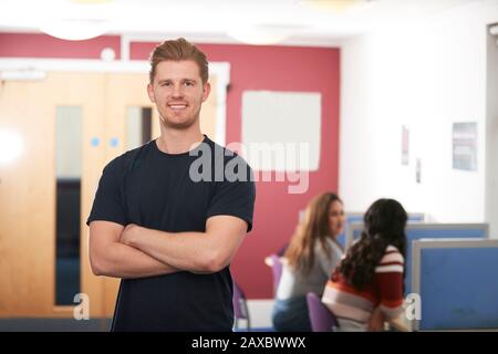 Portrait confident young male college student in library Stock Photo