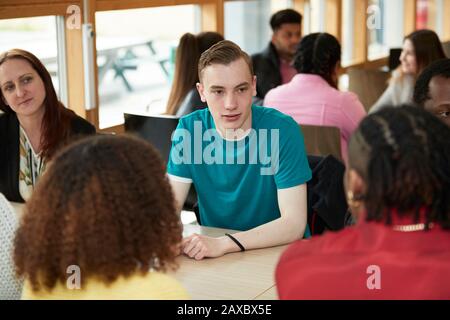 College students talking in classroom Stock Photo