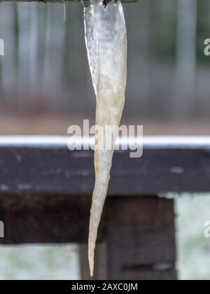 picture with icicle, icicle formed under a wooden table Stock Photo