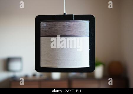 Black, white and brown surface hanging from the ceiling of the room Stock Photo