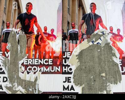 Torn Far-right posters, Lyon, France Stock Photo