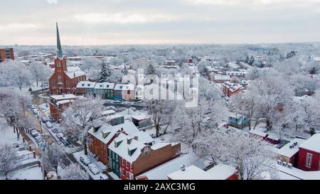 Aerial of historic downtown Lancaster, Pennsylvania with blooming trees ...