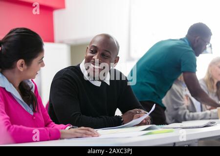 Community college students studying in classroom Stock Photo