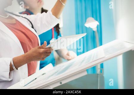 Female doctors with digital tablet in hospital room Stock Photo