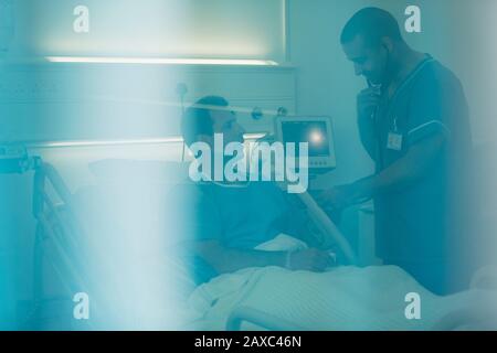 Nurse examining a patient with a stethoscope Stock Photo - Alamy