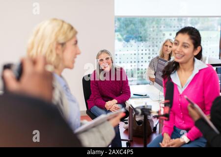 Community college journalism students in classroom Stock Photo