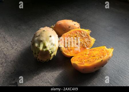 Cactus figs or prickly pear cactus (Opuntia) on a kitchen table Stock Photo