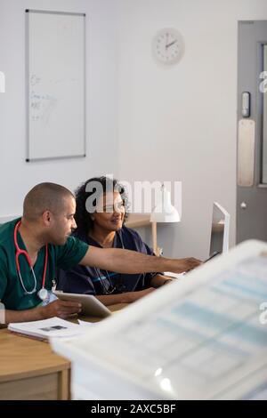 Nurses working at computer in clinic Stock Photo