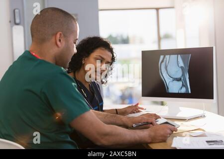 Nurses discussing digital x-ray in clinic Stock Photo