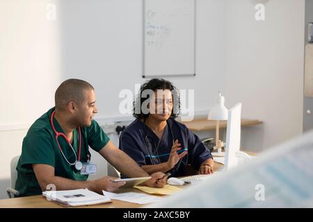 Nurses working at computer in clinic Stock Photo