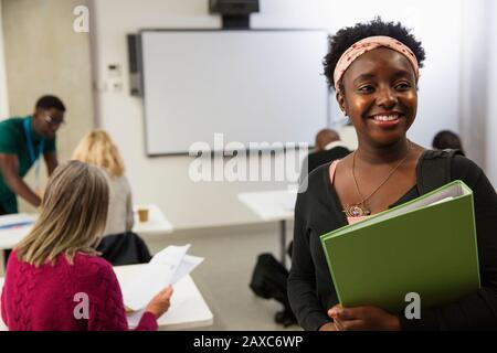 Portrait smiling, confident female community college student in classroom Stock Photo