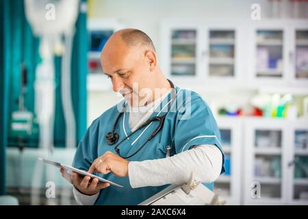 Male doctor using digital tablet in hospital Stock Photo