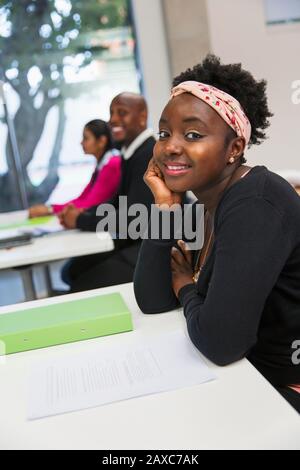 Portrait smiling, confident female community college student in classroom Stock Photo