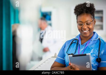 Female nurse using digital tablet in hospital Stock Photo