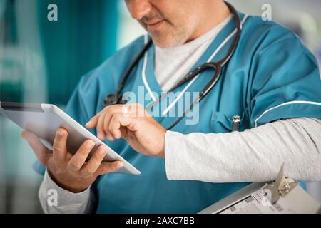 Male doctor using digital tablet Stock Photo