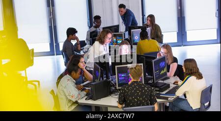 Junior high students using computers in computer lab Stock Photo
