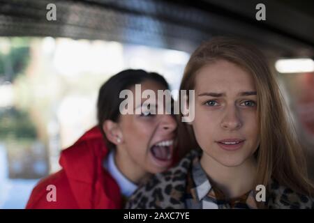 Angry young woman yelling at friend Stock Photo