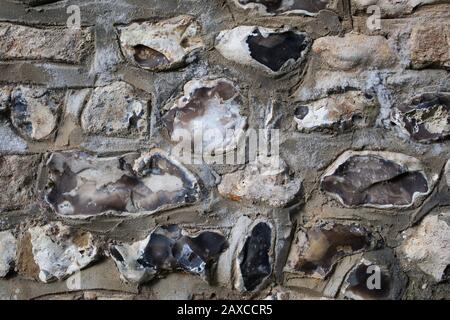 An ancient stone wall in Winchester, UK Stock Photo