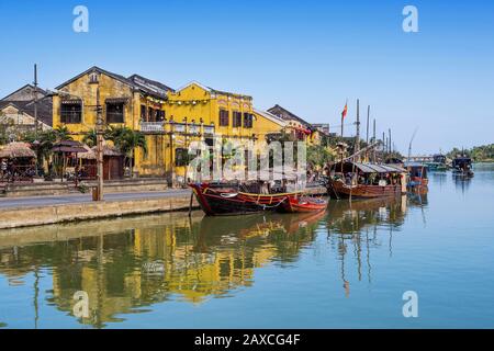 Traditional wooden boats on the Thu Bon River in Hoi An Ancient Town, Central Vietnam. Stock Photo