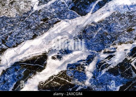 Glossy blue marble. Sample of natural marble with a pronounced texture. Stock Photo