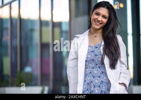 Beautiful smiling portrait of Indian American woman, medical practitioner, dental hygienist, scientist, health care specialist in medicine Stock Photo