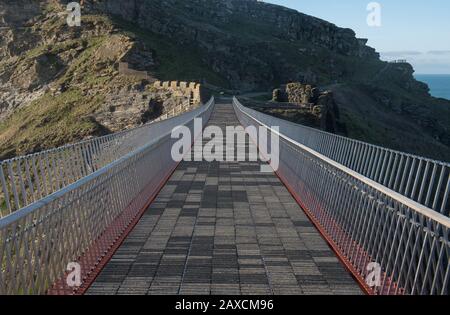 Steel Cantilever Footbridge Linking The Ruins of Tintagel Castle to the Village of Tintagel on the North Cornish Coast in Cornwall, England, UK Stock Photo