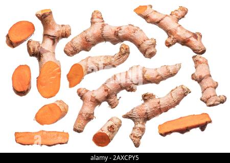 Set of fresh turmeric or curcuma rhizome and slices isolated on white background. File contains clipping path. Stock Photo