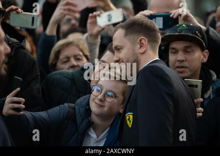 Sebastian Vettel, number 5 driver of Germany and Ferrari, signs autographs for fans during previews ahead of the presentation of F1 2020 Ferrari car on February 11th 2020 out of Teatro Romolo Valli in Reggio Emilia, Italy. (Photo by Lorenzo Di Cola/ESPA-Images) Stock Photo