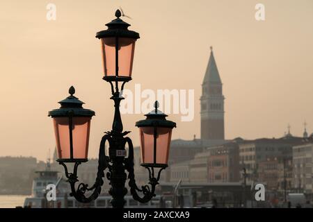 Lanterns in front of doge palace and Campanile in Venice (Italy)