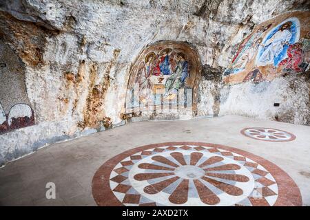 OSTROG, MONTENEGRO - CIRCA JUN, 2016: Interior of upper Church of the Presentation in Ostrog monastery. Beautiful painting is on the wall and floor. I Stock Photo