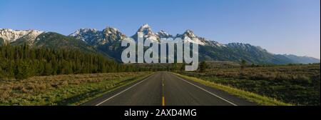 Two lane highway on a landscape, Teton Park Road, Grand Teton National Park, Wyoming, USA Stock Photo