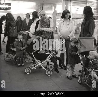 1970s, historical, new mothers and pregnant women gather together with their children at a shopping centre in South London, England, UK, to protest at the lack of contraception advise and support in their neighbourhood. Stock Photo
