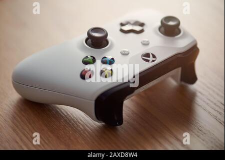 New-York , USA - February  11, 2020: White xbox game pad lay on wooden table close up Stock Photo