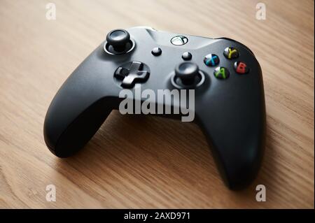 New-York , USA - February  11, 2020: Black  color xbox game pad on wooden table close up view Stock Photo