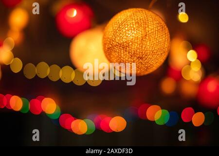 Abstract blurred of orange and red glittering shine bulbs lights background bokeh Stock Photo
