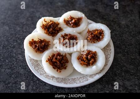 Popular Singapore breakfast food made of steamed rice cake with preserved radish known as Chwee Kueh is originally a Teochew cuisine dish. Stock Photo