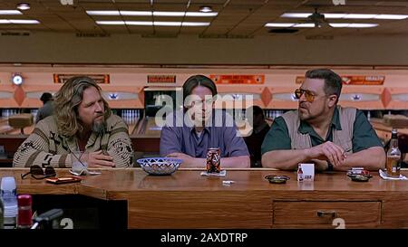 The Big Lebowski (1998) directed by Joel and Ethan Coen and starring Jeff Bridges as Jeffrey 'The Dude' Lebowski, Steve Buscemi as Donny Kerabatsos and John Goodman as Walter Sobchak in this cult classic about The Dude’s journey for compensation for his ruined rug. Stock Photo