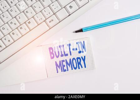 Text sign showing Built In Memory. Business photo text device or feature are included in something as a part of it White pc keyboard with empty note p Stock Photo