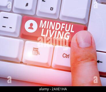 Writing note showing Mindful Living. Business concept for Having a sense of purpose and setting goals in life Stock Photo
