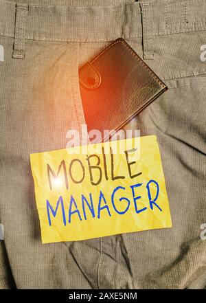 Word writing text Mobile Manager. Business photo showcasing monitor, analysisage and secure employees mobile devices Small little wallet inside man tr Stock Photo