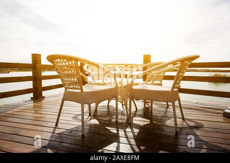 Desks and chairs in the sun Stock Photo