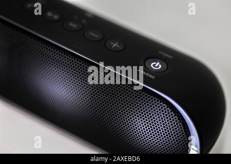 Black Bluetooth speaker with lights on isolated in white background Stock Photo