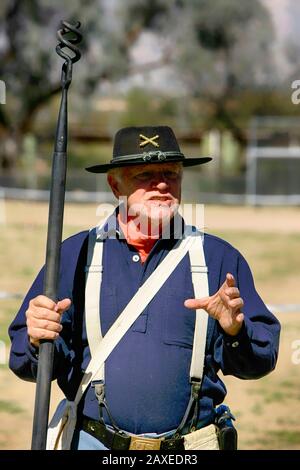 Renactor dressed in a uniform of the 1880s US Army artillery man in the 5th Cavalry at Fort Lowell, Tucson AZ Stock Photo