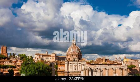 View of Rome historic center skyline from Capitoline Hill, with ancient ruins, medieval towers and baroque and renaissance domes Stock Photo