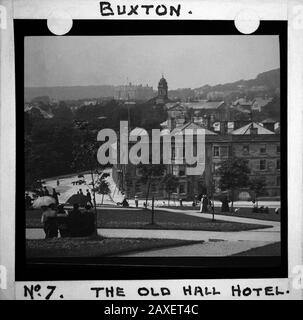 The old Hall Hotel, Buxton Crescent & Thermal Spa Hotel & Palace Hotel during the Victorian period c1890, Victorians in front of the Bath House, antique old glass magic lantern slide picture. The newly renovated hotel is due to open in 2020 creating a northern capital for health and wellbeing. Antique Magic Lantern Slide.  Original photographer unknown, copyright period expired.  Digital photography, restoration, editing copyright © Doug Blane. Stock Photo