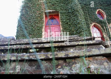 Entrance to the Rehoboth Rock Church/ Rehoboth Mennonite Church in Schuyler, VA, USA. Exterior walls covered in English Ivy. Stock Photo