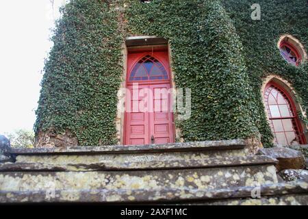 Entrance to the Rehoboth Rock Church/ Rehoboth Mennonite Church in Schuyler, VA, USA. Exterior walls covered in English Ivy. Stock Photo