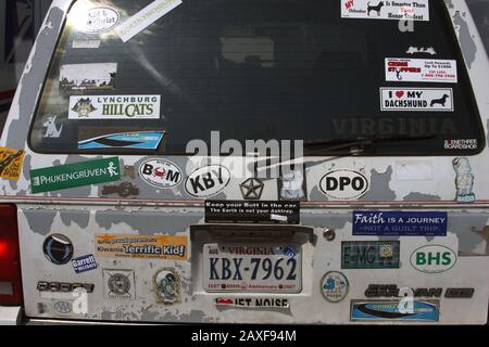 Old van's back covered in stickers Stock Photo