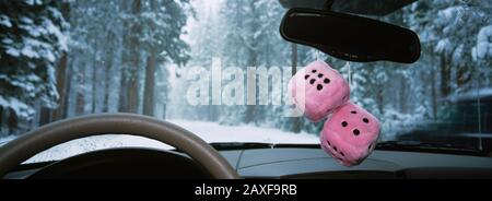Close-up of a pair of fuzzy dices hanging from the rear view mirror of a car, Yosemite National Park, California, USA Stock Photo